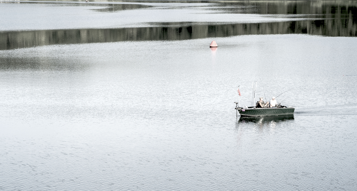 Fishing Boat on Barrier Lake Hennesee in Sauerland, Germany